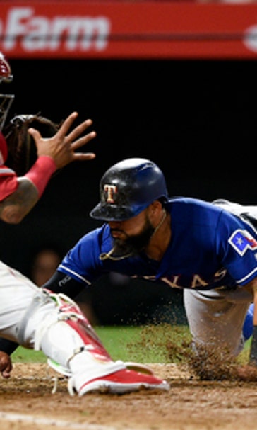 Odor dives home in 10th to lift Rangers over Angels 3-2
